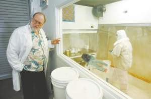 Brad Horn/Nevada Appeal Dr. John Holliday displays a mushroom sample at Aloha Medicinals plant in Carson City on Friday.